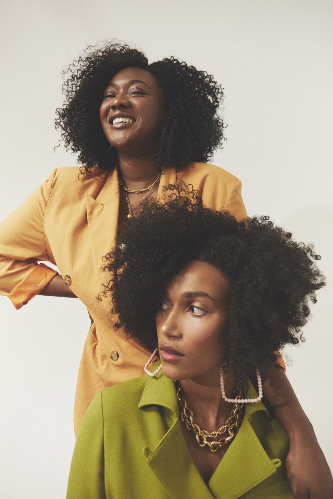 Two women in mustard and green, from the RadSwan campaign