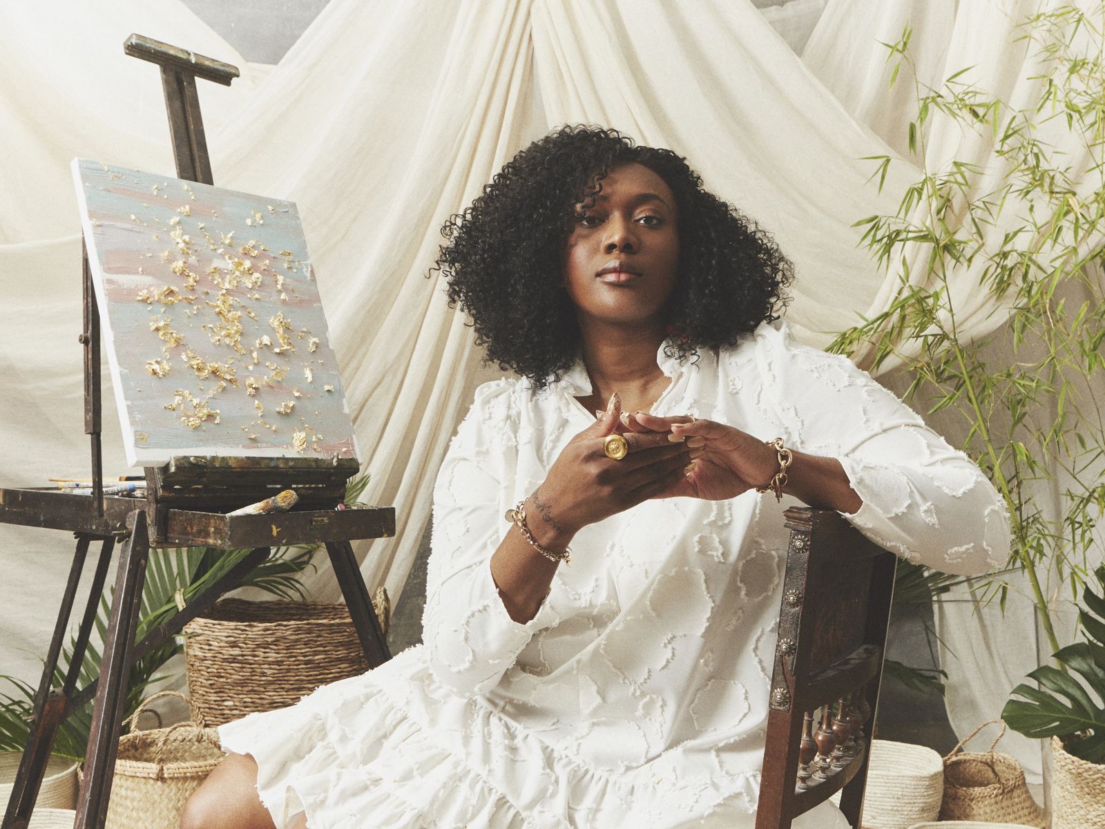 A woman in a white dress with afro-textured hair, RadSwan campaign